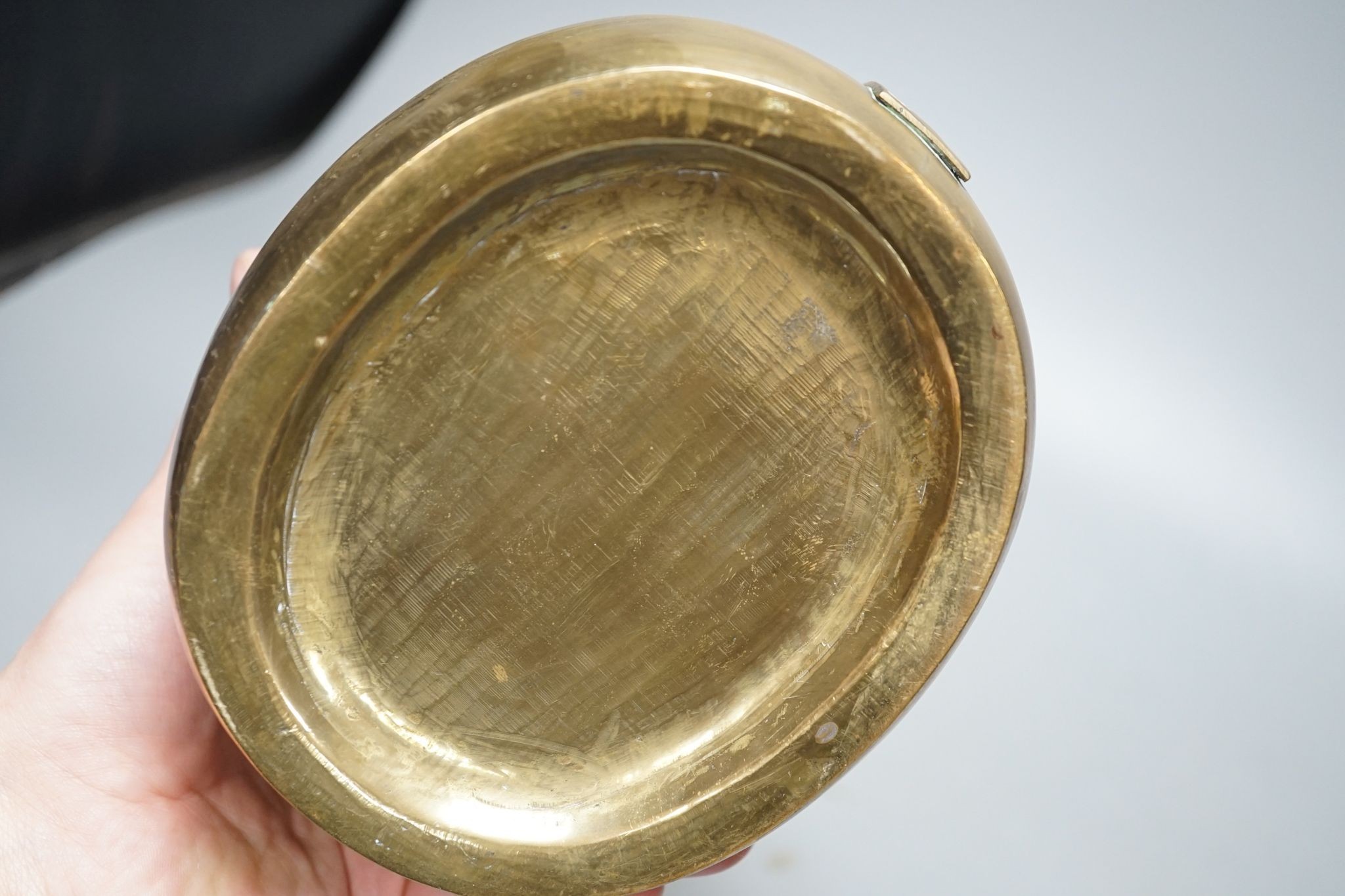 A Chinese bronze tripod censer, 13.5cm and two brass or bronze hand warmers